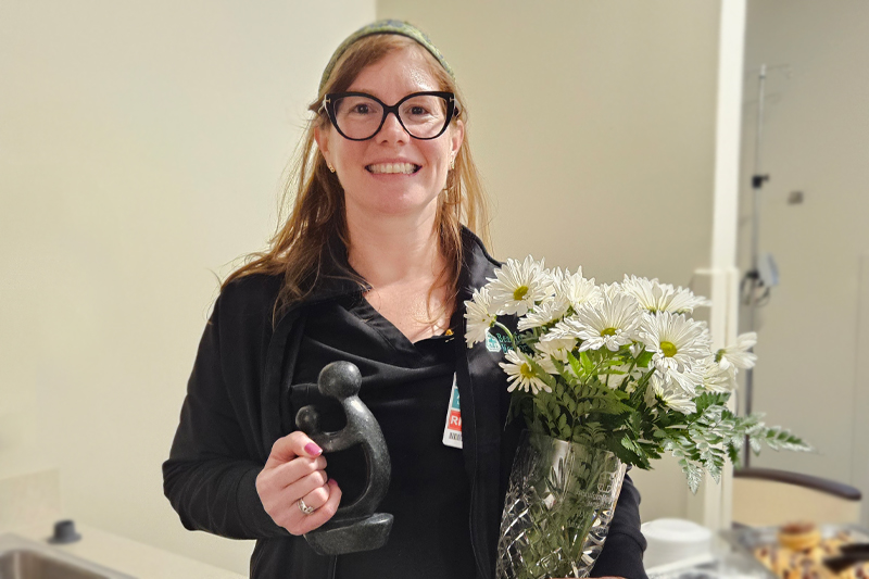 Annie Loughlin, RN, BSN with her DAISY award on February 3, 2025