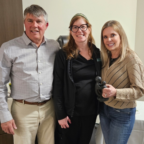 Annie Loughlin, RN, BSN with Bill Scheper, left, and Jill Scheper, right