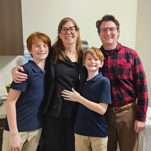 Annie Loughlin, RN, BSN with her husband and two sons