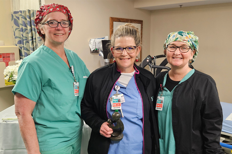 Nancy Morrison, RN, BSN (center) with Manager of Cardiovascular Services, Robin Stoltz, RN, BSN (left), and Director of Cardiovascular and Pulmonary Services, Sharon Shupe, RN, MSN (right)