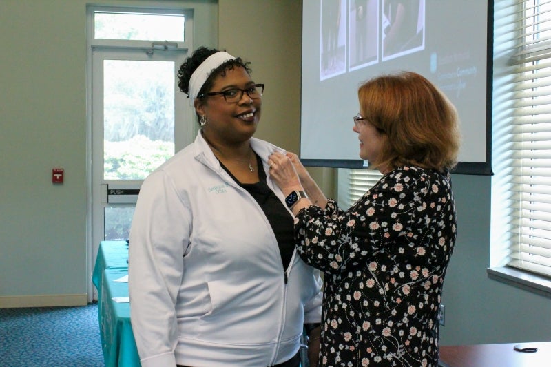 Sequina Register, CCMA gets her pin for earning national certification as a Certified Clinical Medical Assistant