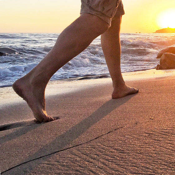 man walking on beach