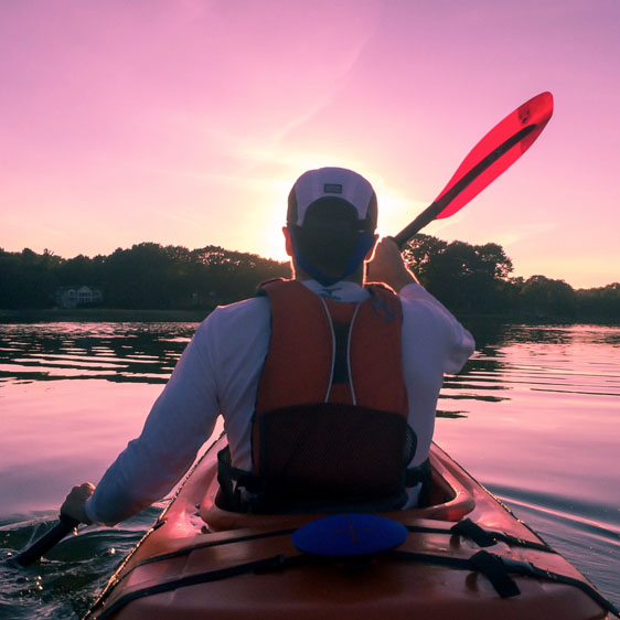 man kayaking at sunrise in the lowcountry