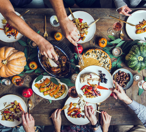 thanksgiving table with friends gathered