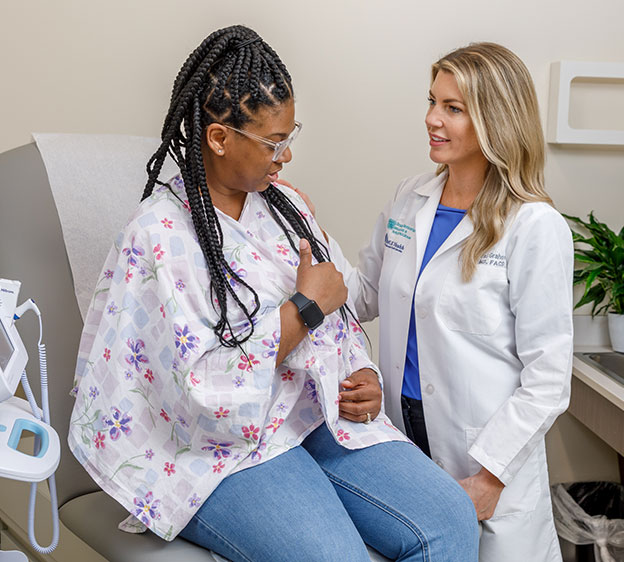 Dr. Tara Grahovac performing an exam on a patient.