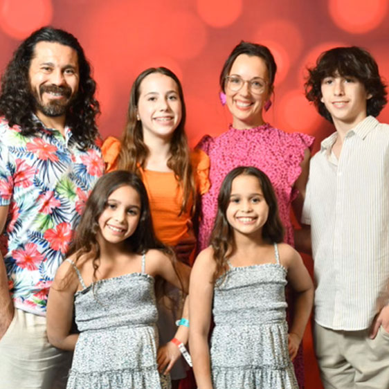 Adam Flores photographed with his wife, Bailey, and their four children, 14-year-old Xavier, 12-year-old Eliza, and 9-year-old twins Phoebe and Piper