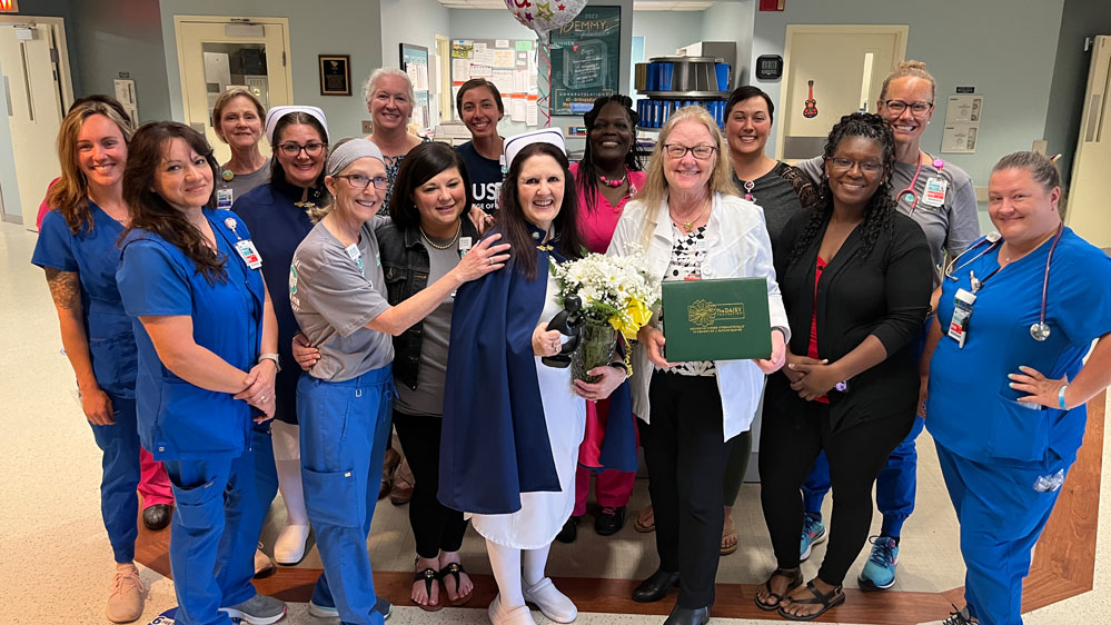 Lisa Terwilliger, RN, poses with the 4T team after receiving The DAISY Award