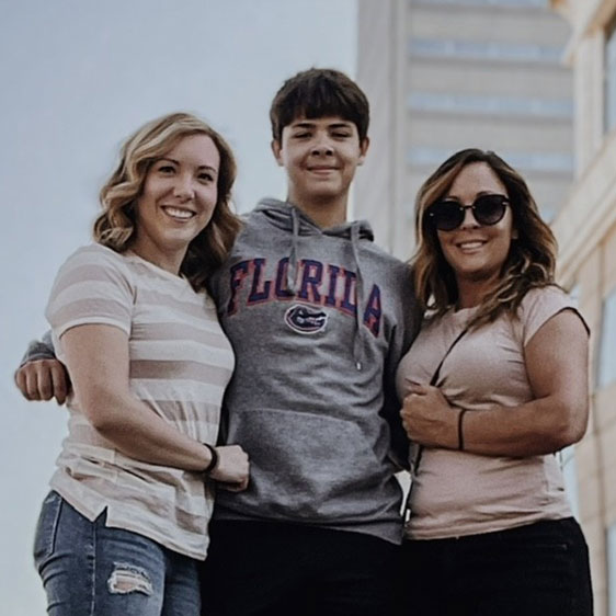 Samantha Bruns photographed with her fiancee Jayme and stepson