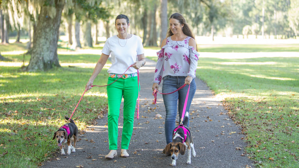 Paula Davis takes the dogs for a walk with her sister-in-law Amy Parent