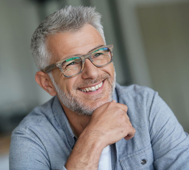 Middle-age man with glasses smiling