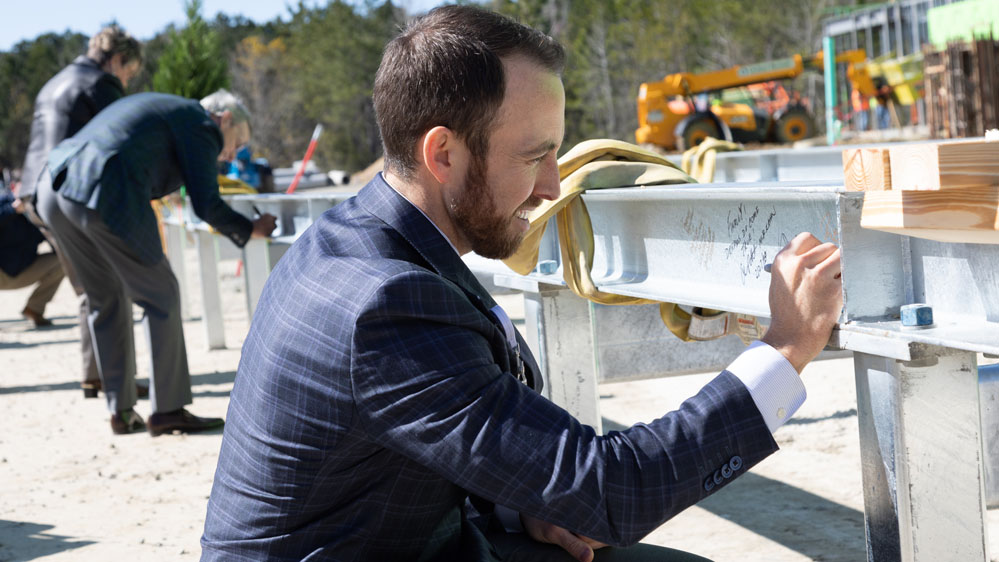 Russell Baxley signing beam 