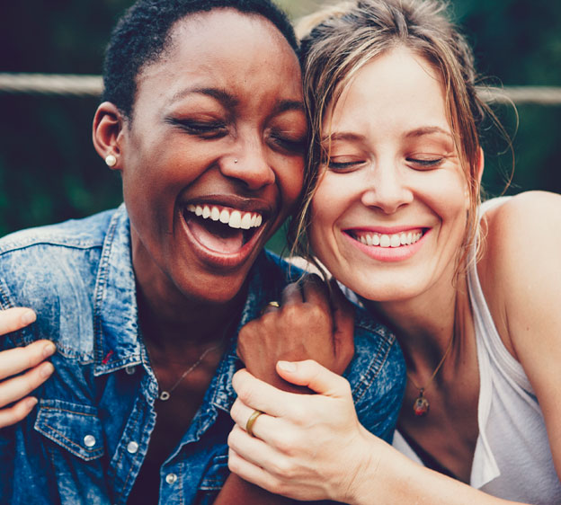 Two women laughing together