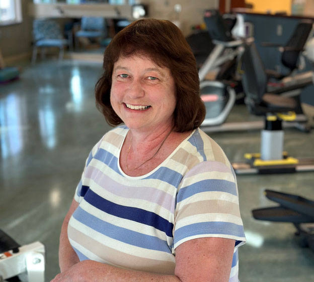 Ashley Sanders smiles while at the physical therapy gym