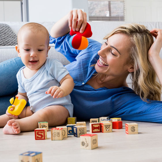 mom playing with baby