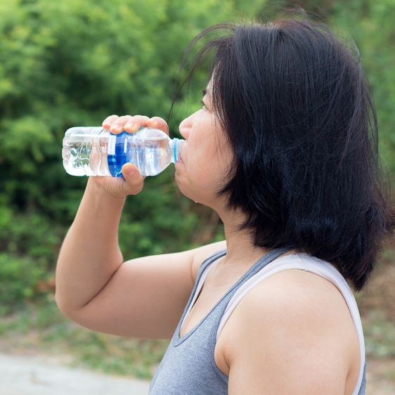 woman taking a water break