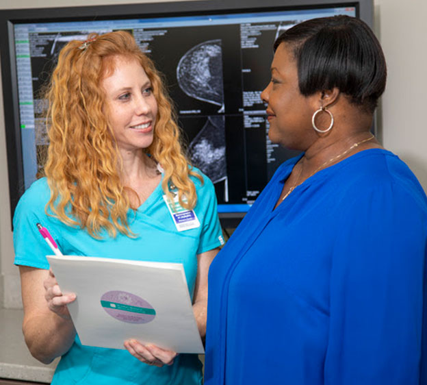 A Beaufort Memorial mammography technologist assisting a female patient having a mammogram