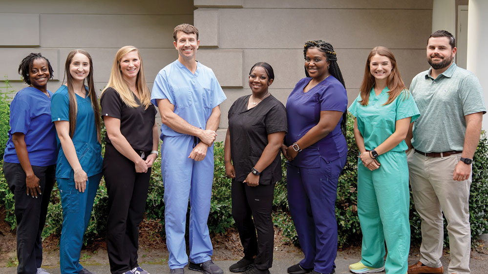 The Beaufort Memorial Urology Specialists team poses outside the office building