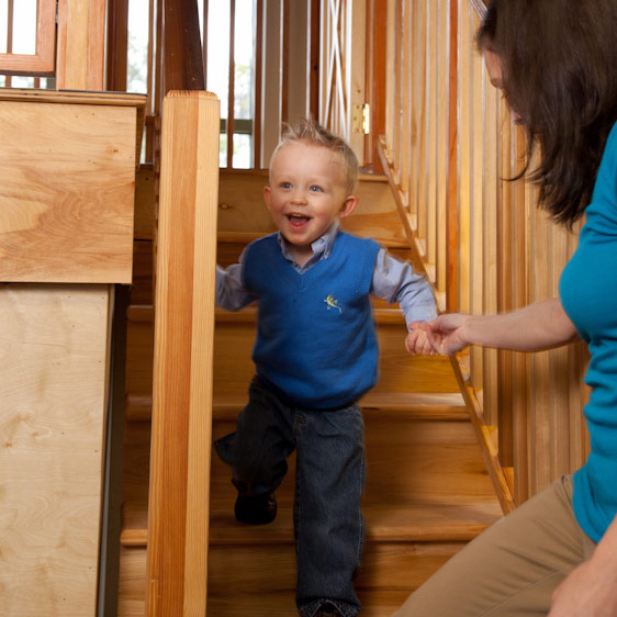 A toddler boy plays in a treehouse in Beaufort Memorial's pediatric occupational therapy center