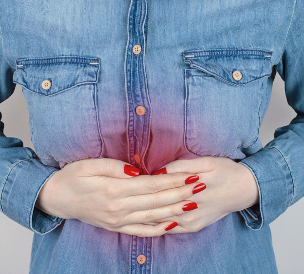 Woman holding her stomach in pain