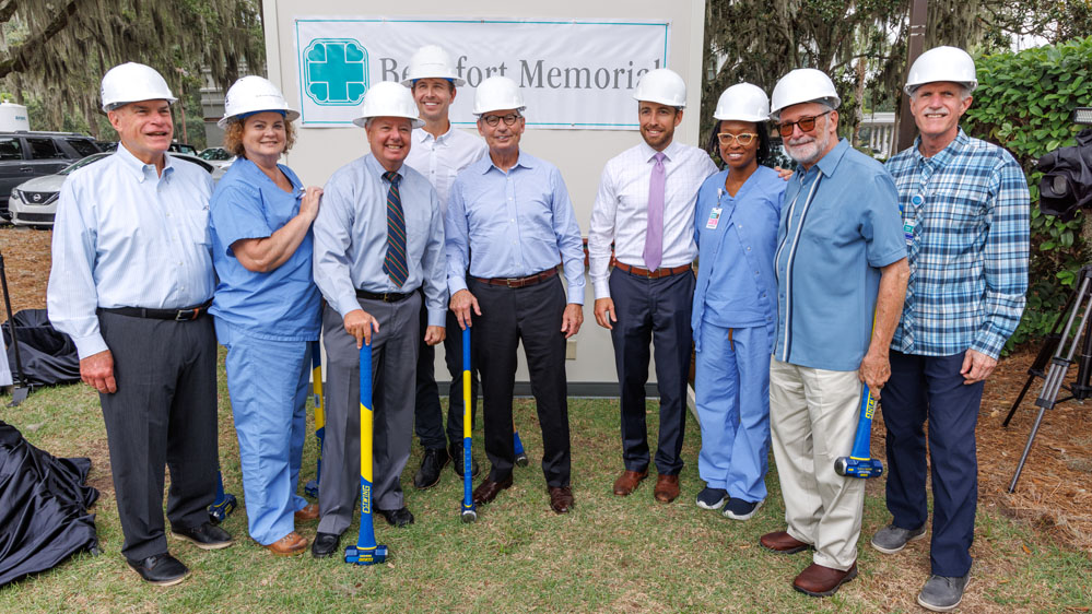 Group poses with sledgehammers