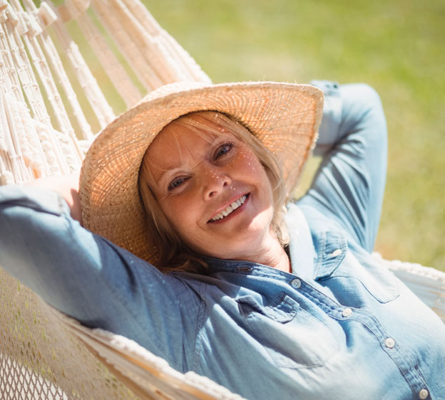 woman laying on a hammock