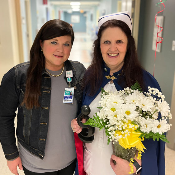 Dana Aiken, RN, smiles next to Lisa Terwilliger, RN