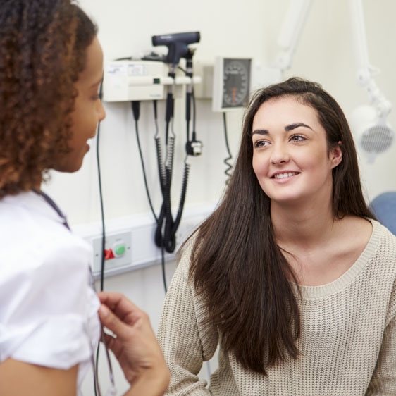 teen speaking with her gynecologist