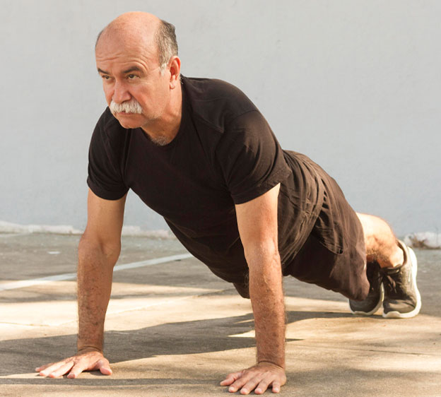 Older man holding a plank position