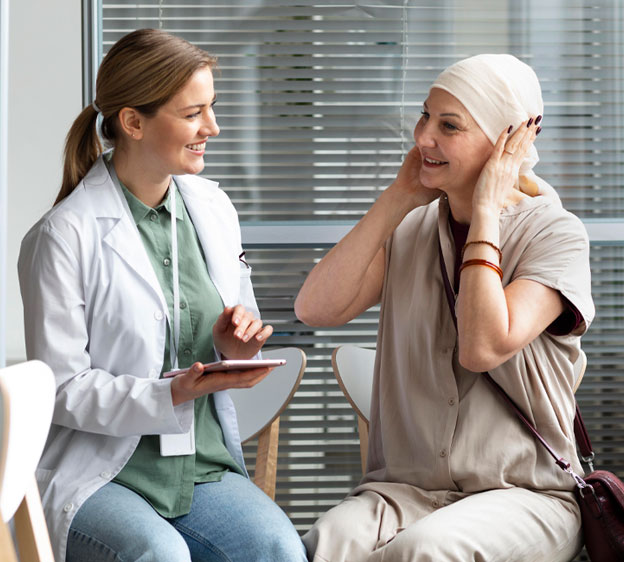 Physician speaking with a patient who has had chemotherapy