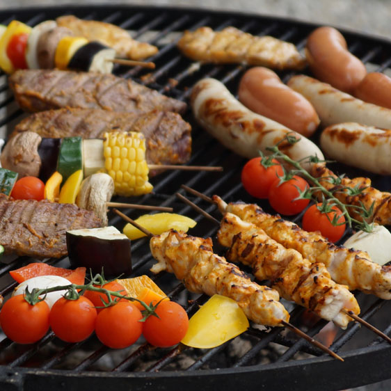 meats and vegitables on the grill