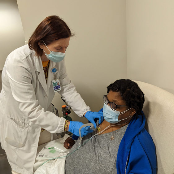 Annemarie Gault, nurse practitioner, with a patient