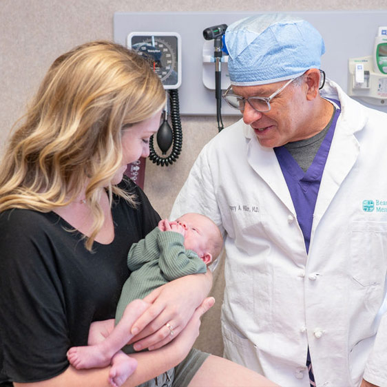 A photograph of Dr. Gregory A. Miller and Shannan Sanders at a hospital