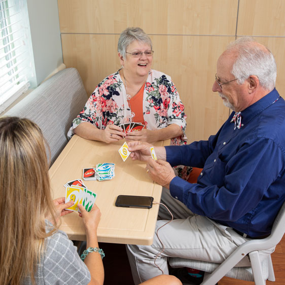 family playing cards in postpartum