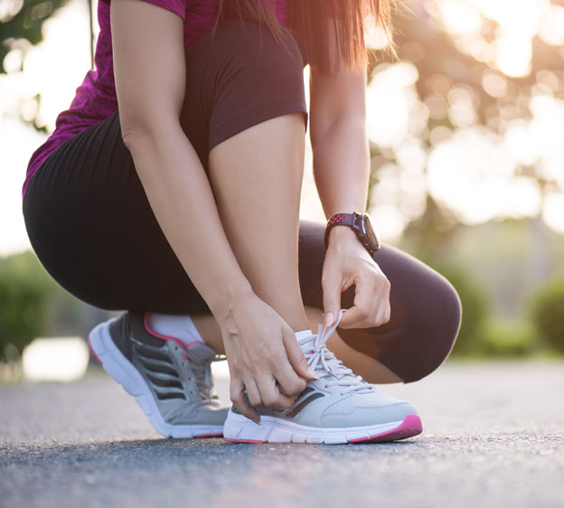 woman tying her sneakers