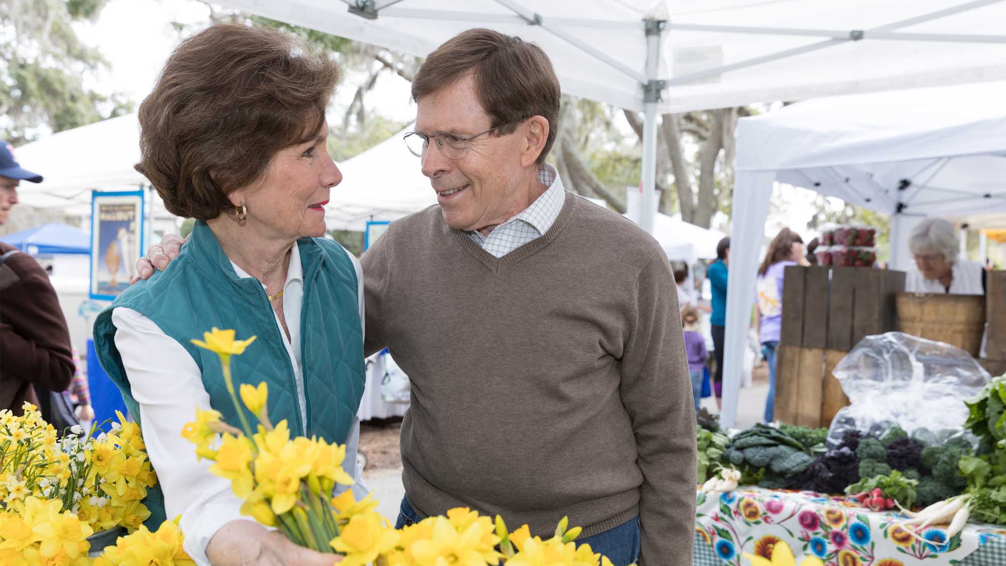 knee replacement patient enjoys walking through farmers market