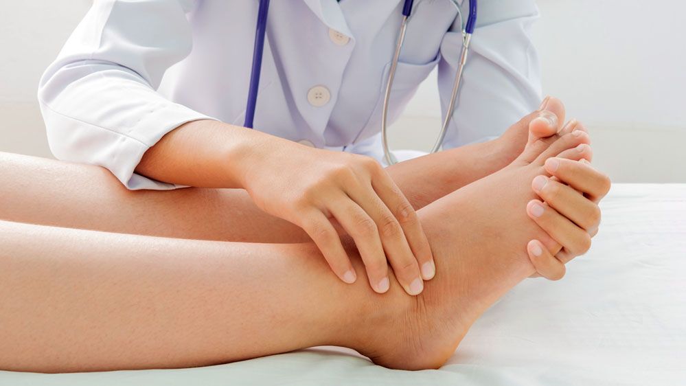 Provider Examining a Patient with Foot and Ankle Pain