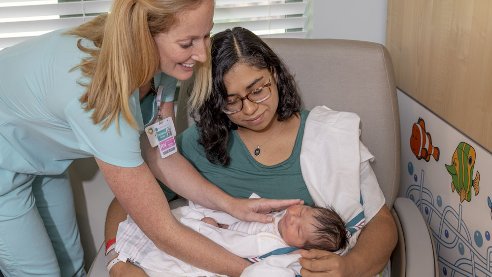 lactation consultant assisting new mom