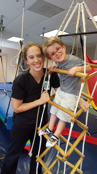 pediatric physical therapy patient working on stairs