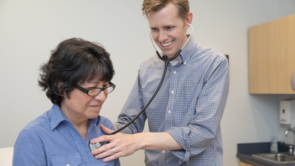 Family Medicine physician Roger Ulrich, MD, with patient