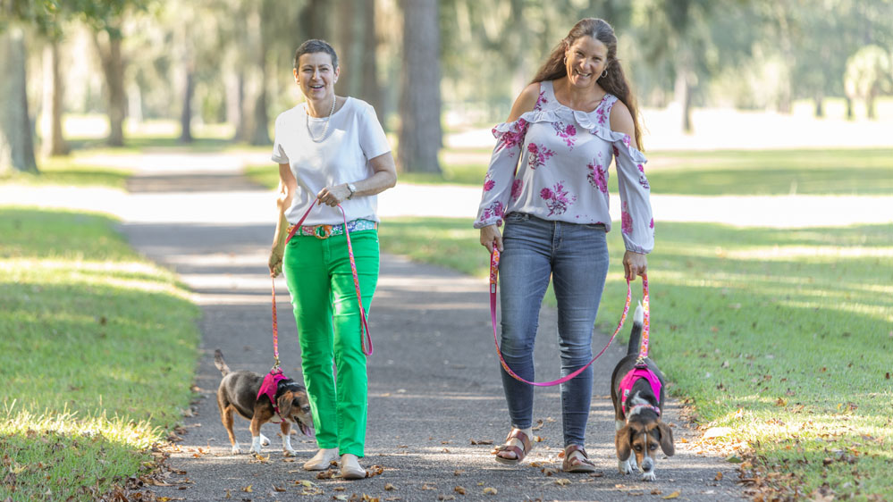 Lumpectomy patient, Paula Davis, walking her dog