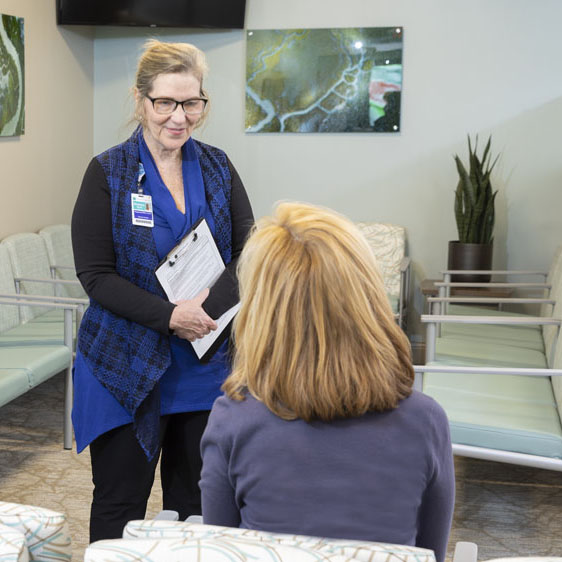 business professional talking to patient