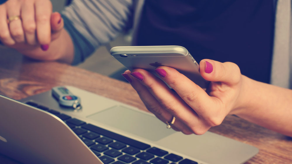 woman using her phone to access medical records