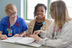 nurses reviewing charts