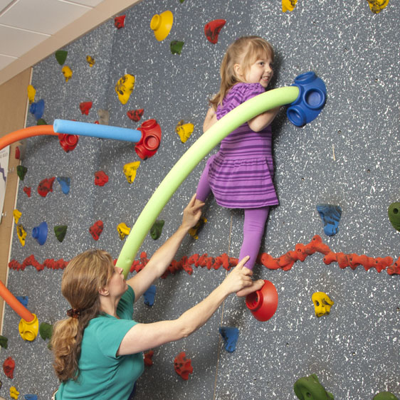 child on climbing wall