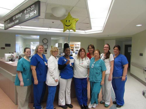 nurses on a unit celebrating an award winner